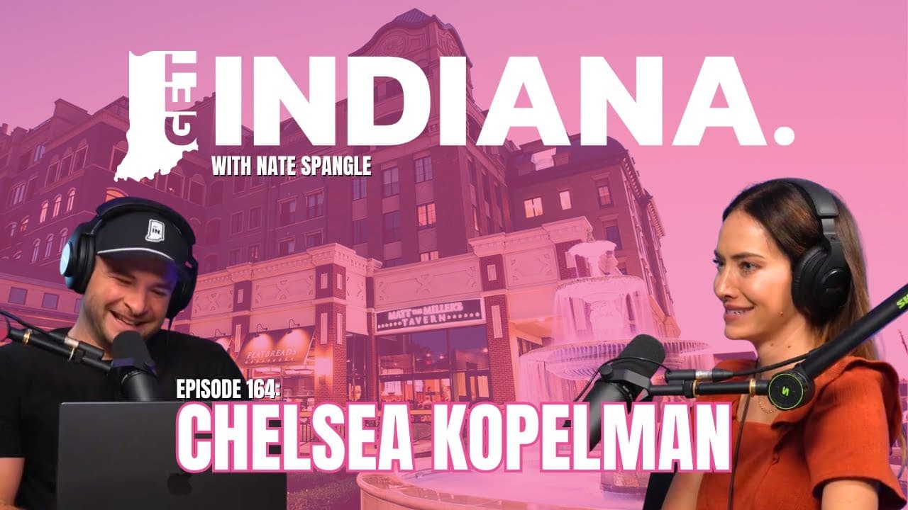 Podcast hosts discuss local influencer networks against a backdrop of Indiana's historic architecture and fountain.