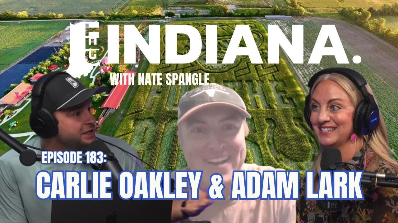 Podcast hosts discuss Indiana attractions with a vibrant corn maze backdrop, showcasing local culture and events.